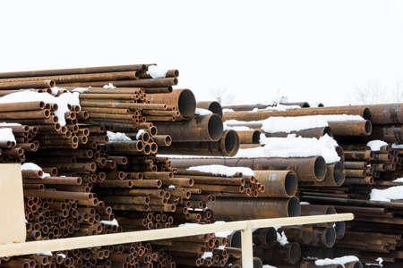 Metal rolling. A round tube of different sizes are available in the open air winter.の写真素材