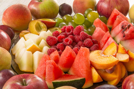 Fruit mix. Peach, grapes, apple, watermelon, melon, raspberry, plum. Juicy and fruit pieces