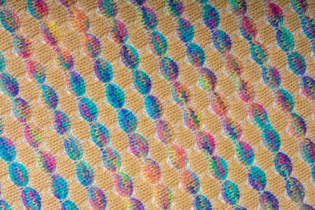 Abstract background. Colored knitted fabric texture, diagonal lines, flat lay