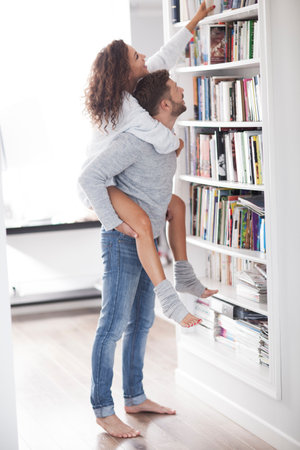 Sexy and elegant couple are kissing in home.の写真素材