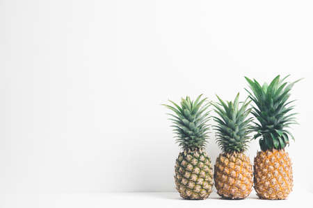 Pineapples and wall white backgroundの写真素材