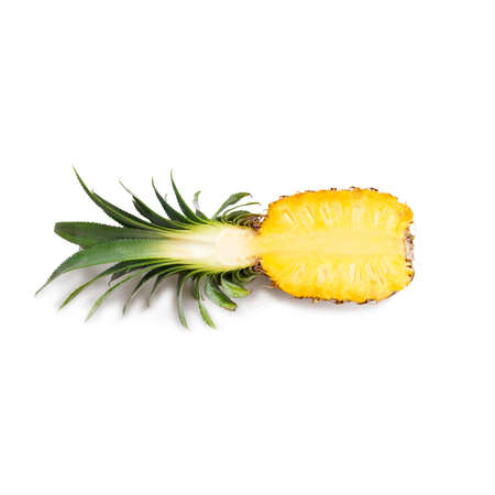 Half of a pineapple and wall white backgroundの写真素材