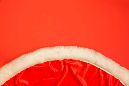 Close-up of Santa's clothes. Red christmas background. Empty blank copy space for text.の写真素材