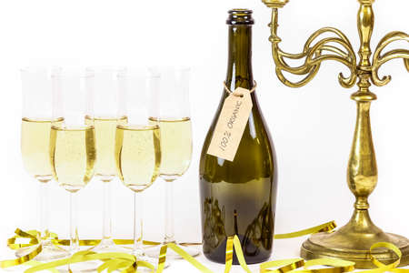 Organic wine / champagne. Glasses of champagne, candelabra and party streamers. For new years eve...
