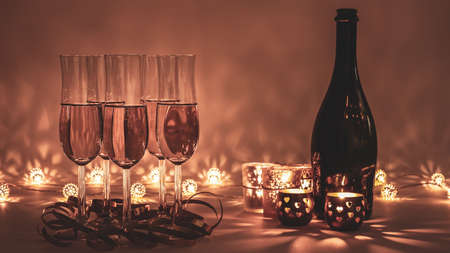 Cozy evening with glasses of champagne. For celebrations and special moments. Warm decoration light, candles and bottle in background.の写真素材