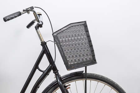 Old vintage black lady bicycle with a basket.の写真素材