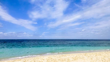 Perfect white beach with turquoise water all the way down the horizon. Dominican Republic.の写真素材