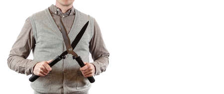 Large scissor. A gardener holding a hedgecutter. Shirt and gray cardigan. Plenty of space for your...