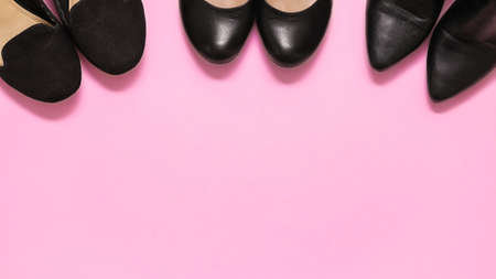 Three pairs of black women's shoes, pumps and high heel shoes for parties, casual and buisness women. Pink background. Blank copy space for own text.の写真素材