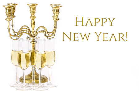 Elegant, simple image. Glasses of champagne and candelabra. For new years eve celebration. Empty copy space for text on white background.の写真素材