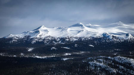 Winter landscape with dramatic snowy mountains.の写真素材