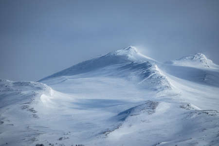 Winter landscape with dramatic snowy mountains.の写真素材