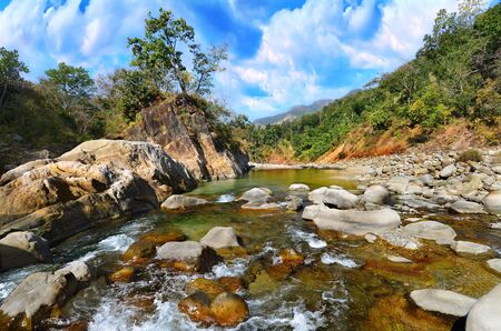 Mountain river in the Himalayas flows among the rocky stones steep shores  Uttarakhand, Indiaの写真素材