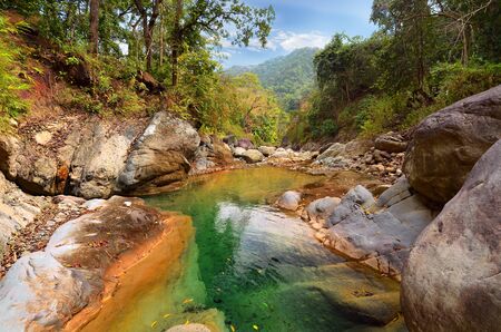 Mountain river in the Himalayas flows among the rocky stones steep shores  Uttarakhand, Indiaの写真素材