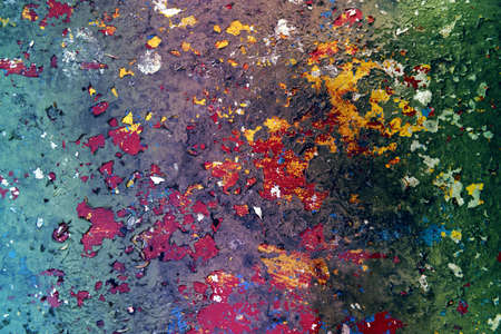 Old wall with the multi-colored, cracked paintの写真素材