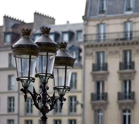 Old streetlights in Paris, France against a soft-focus backgroundの写真素材