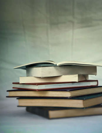 A stack of very old books, short depth of field, creative blursの写真素材