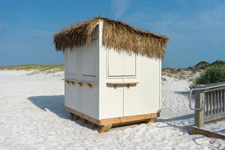 Landscape of grass thatched concessions stand or hut at a Florida beach.の写真素材