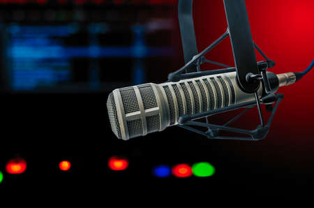 Professional microphone and sound waveform on screenの写真素材