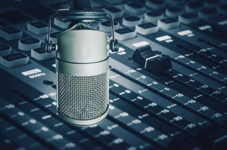 Professional microphone and sound mixer in radio station studio