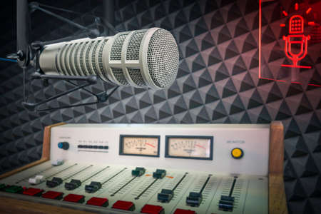 radio station studio: professional microphone and sound console