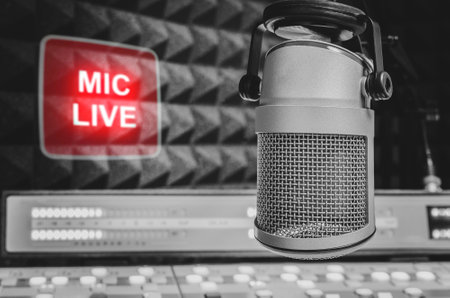 Professional microphone in radio station studio and on air signの写真素材