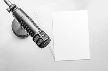 Professional microphone and blank sheet of paperの写真素材