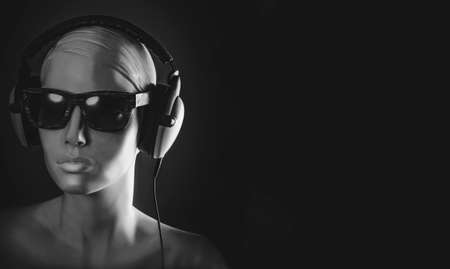 mannequin in sunglasses and headphonesの写真素材