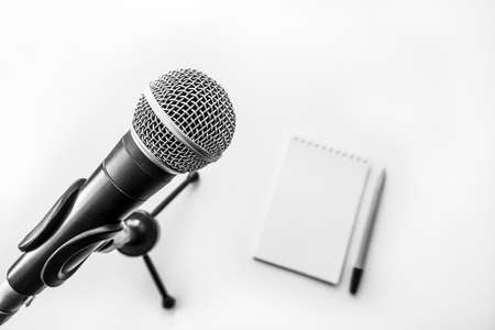 Professional microphone and blank sheet of paperの写真素材