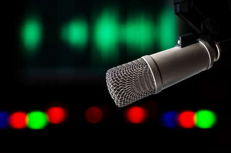Professional microphone and wave form on the screenの写真素材