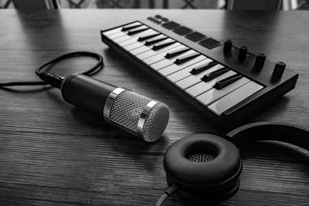 Home music studio: microphone, midi keyboardの写真素材
