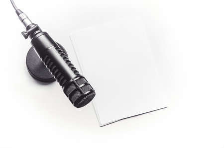 Professional microphone and blank sheet of paperの写真素材