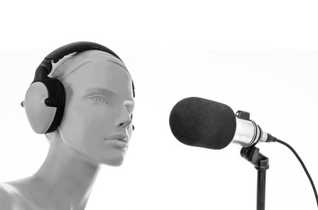 mannequin in headphones and microphoneの写真素材