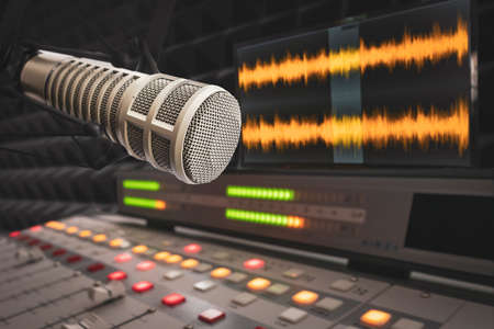 Professional microphone, sound mixer and wave form on the screenの写真素材