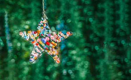 background with a decorative star made of beadsの写真素材