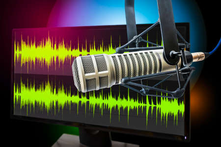 Background with a professional microphone and wave form on screen