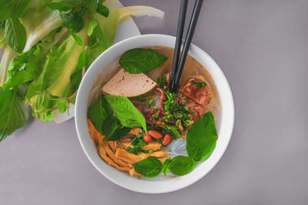 vegan vegetable soup with tofu and noodlesの写真素材