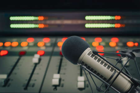 Professional microphone and sound mixer in radio station studio