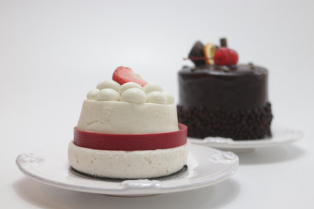 Fruit cake with chocolate and strawberry on white background. Selective focus.の写真素材