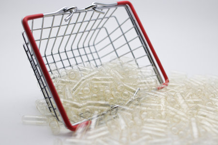 Shopping basket full of transparent capsule on a white background.の写真素材