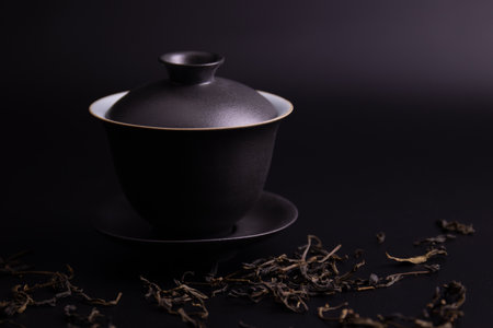 Black Chinese Tea Cup on Black backgroundの写真素材