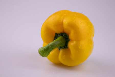 Yellow bell pepper on a white background. Selective focus. High quality photo
