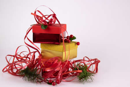 Red Gift box on white background with messy red ribbon and ornaments for gift decoration , red...