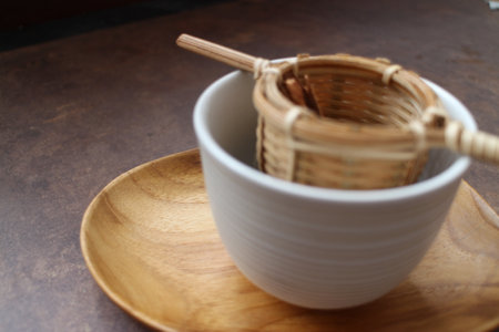 Bowl of tea on a wooden table. Selective focus.の写真素材