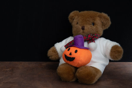 Celebrate Halloween with Teddy Bear and Orange Pumpkin "Jack O'Lantern"の写真素材