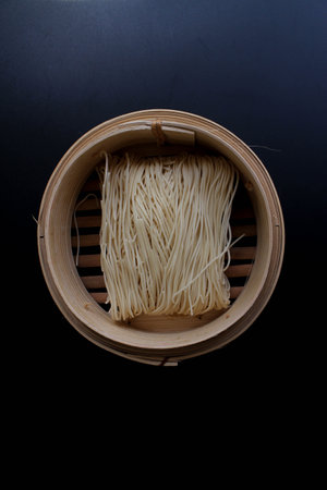 close up of dried Chinese noodle for Chinese New Year on white background, food