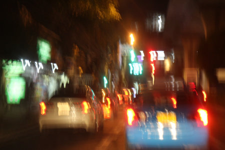 Blurred view of car in city at night. Intentional motion blur