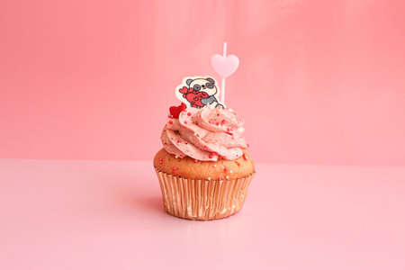 Strawberry Cupcake topped with a chocolate panda holding the wording  Love on Pastel Pink Background