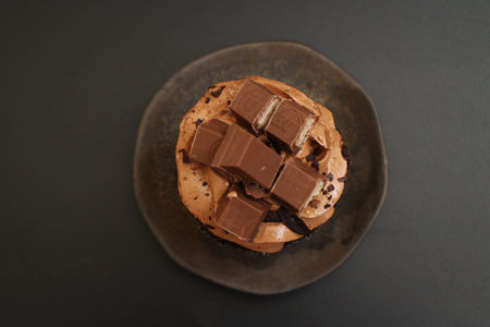 Top View of Delicious Chocolate Cup Cake topped with chocolate wafers