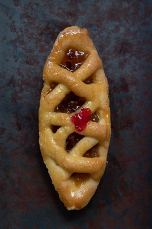 Sweet waffles with jam on a dark background. Top view.